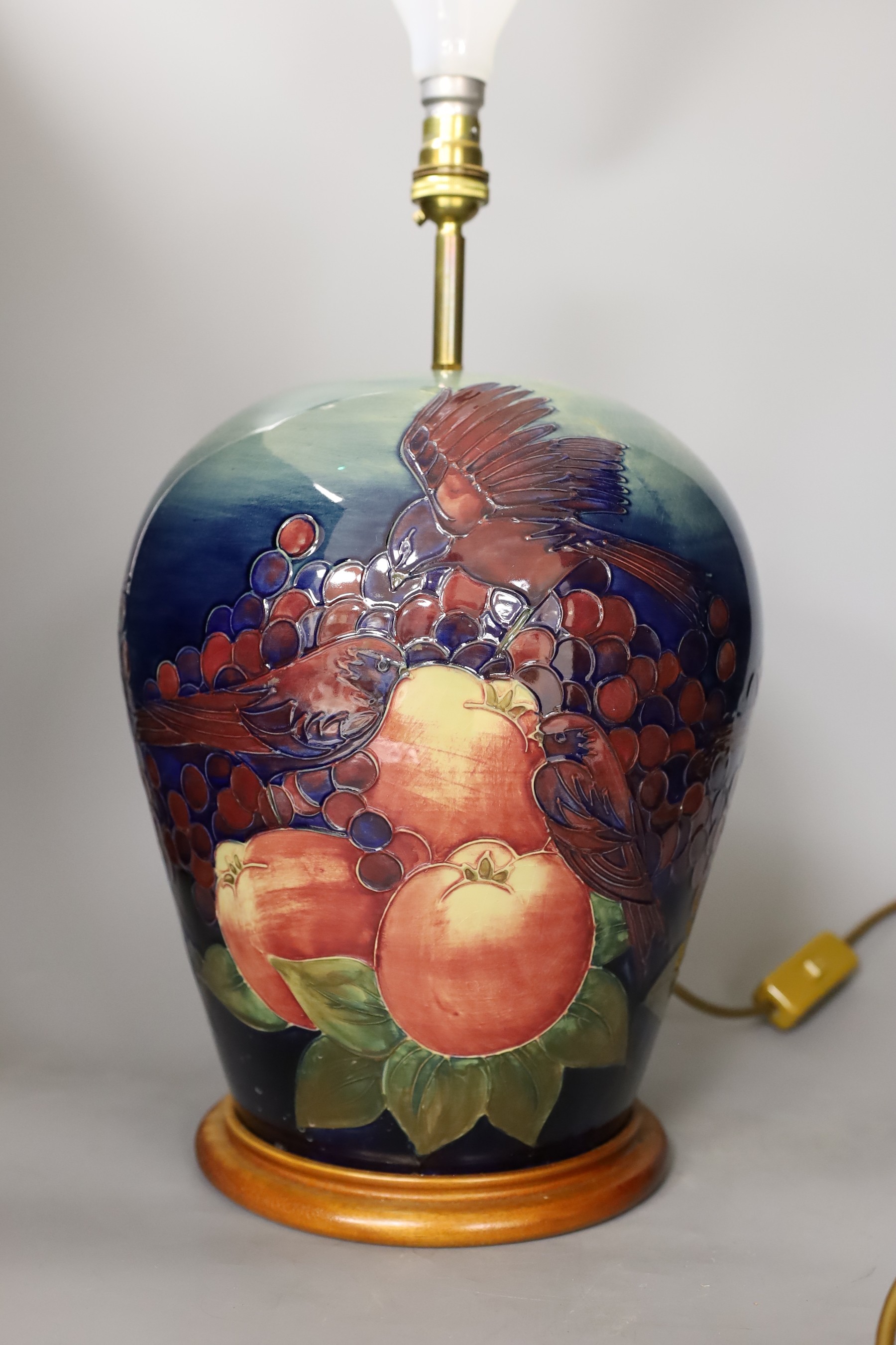 A Moorcroft pottery 'finches and fruit' vase lamp, 33cm to top of pottery